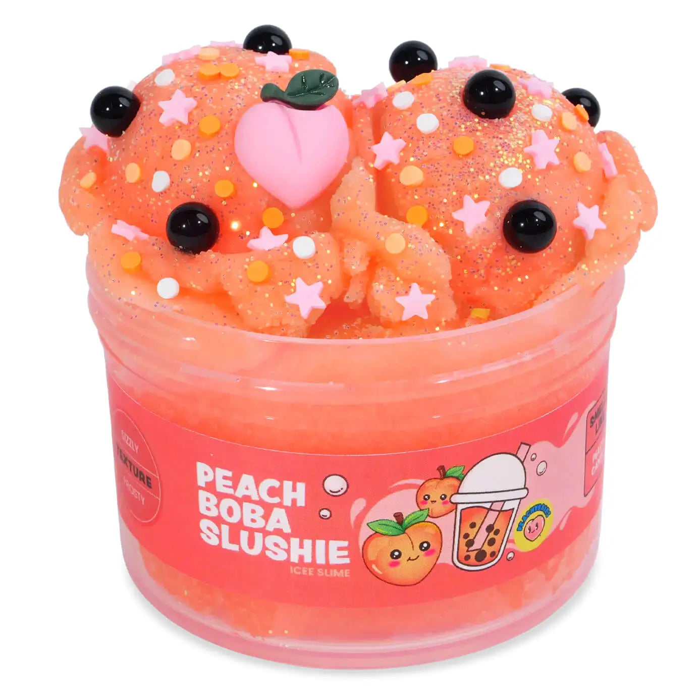 Peach-orange icee slime with a textured, slushy appearance, topped with a pink peach charm, black boba pearls, star confetti, and glitter, packaged in a jar labeled Peach Boba Slushie Icee Slime.