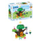 Disney Playmobil Junior Winnie the Pooh playset with bright green plastic tree house, smooth brown trunk, shape-sorting pieces, swing seat, and characters displayed in a soft pastel outdoor scene.