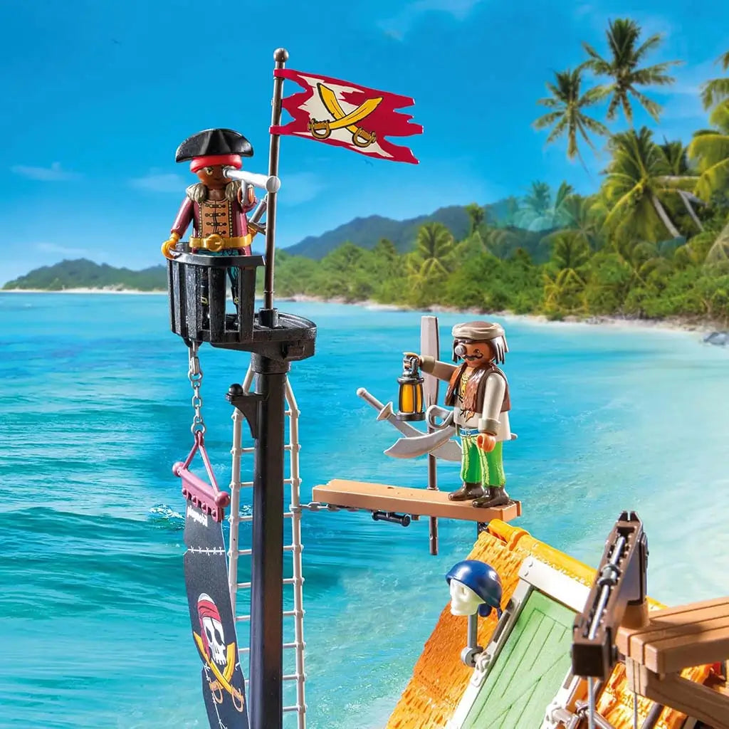 Playmobil pirate lookout scene shows a tall mast with flag, ladder, lantern, and pirate figures overlooking a vivid island shoreline, highlighting imaginative seafaring role-play elements.