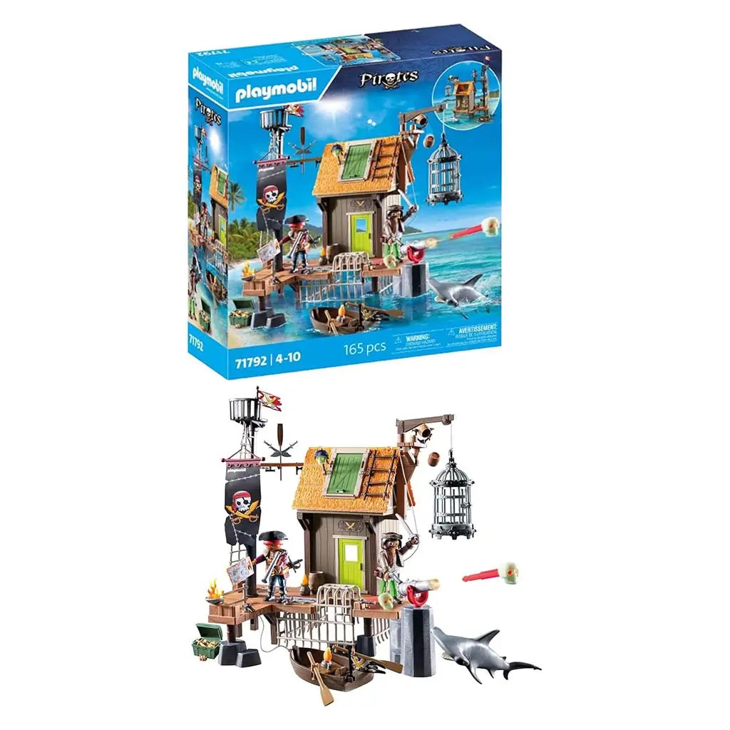 Playmobil Pirates harbor playset shows a wooden shack with docks, pirate figures, shark, hanging cage, and accessories beside the box, highlighting the detailed 165-piece island adventure set.