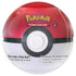 Classic red and white Pokémon TCG Poké Ball Tin with smooth, glossy finish and central circle button design, containing booster packs and sticker sheets, age 6+ label shown.