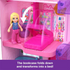 Close-up of Polly Pocket Barbie Dreamhouse bedroom shows pink fold-down bookcase transforming into a bed with doll standing nearby in vibrant miniature setting.