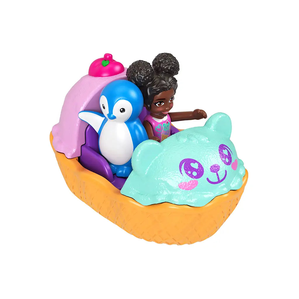 Polly Pocket red-haired doll driving a teal triceratops-shaped toy car with pink wheels, accompanied by a purple brontosaurus passenger, both sitting inside the two-seater vehicle.