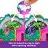 Polly Pocket Peacock Garden playset showing a day-to-night backdrop transformation with spinning background from sunny palace to fireworks scene.