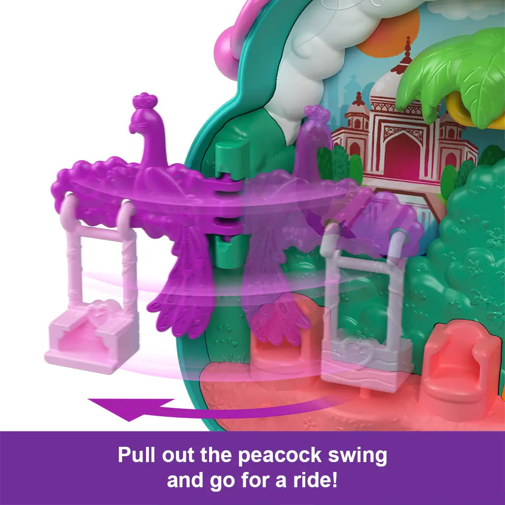 Close-up of Polly Pocket Peacock Garden playset showing a bright purple peacock swing with two seats against a colorful palace garden backdrop.