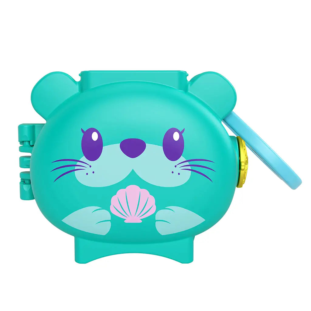 Teal Polly Pocket Otter Locket compact case shaped like a cartoon otter face, with purple eyes, whiskers, seashell detail, and attached side latch for opening and carrying.