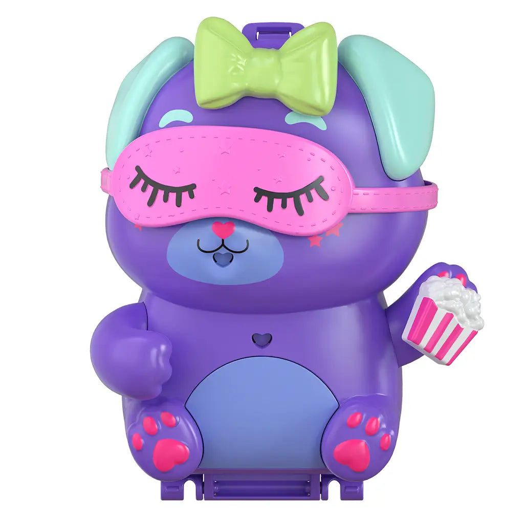 Closed Polly Pocket Sleepover Puppy compact shaped like a purple dog with teal ears, green bow, pink mask, and holding popcorn.