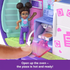 Close-up of Polly Pocket doll beside compact’s kitchen oven with interactive feature showing pizza baking inside, highlighted by arrow animation.