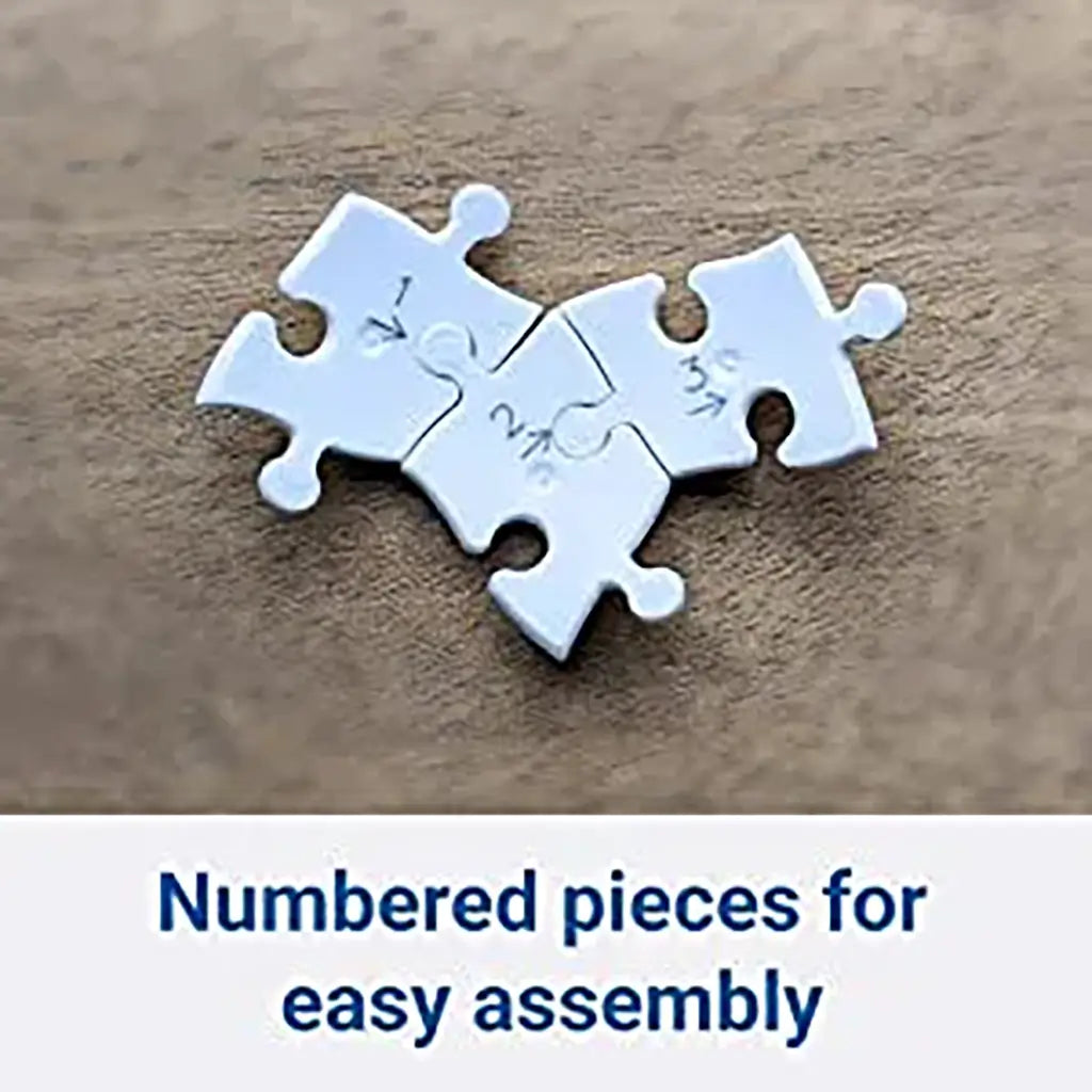 Four white Ravensburger puzzle pieces with visible printed numbers arranged on wooden surface, highlighting numbered system for easy 3D globe assembly.