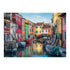 Detailed Ravensburger Burano Italy puzzle image featuring boats along a calm canal, pastel colored houses in pink, green, yellow, and orange, and arched footbridge.