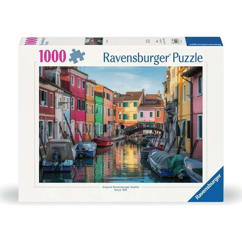 Ravensburger 1000 piece puzzle box featuring colorful Burano, Italy canal with boats, vibrant pastel houses, and arched footbridge under a soft blue sky.