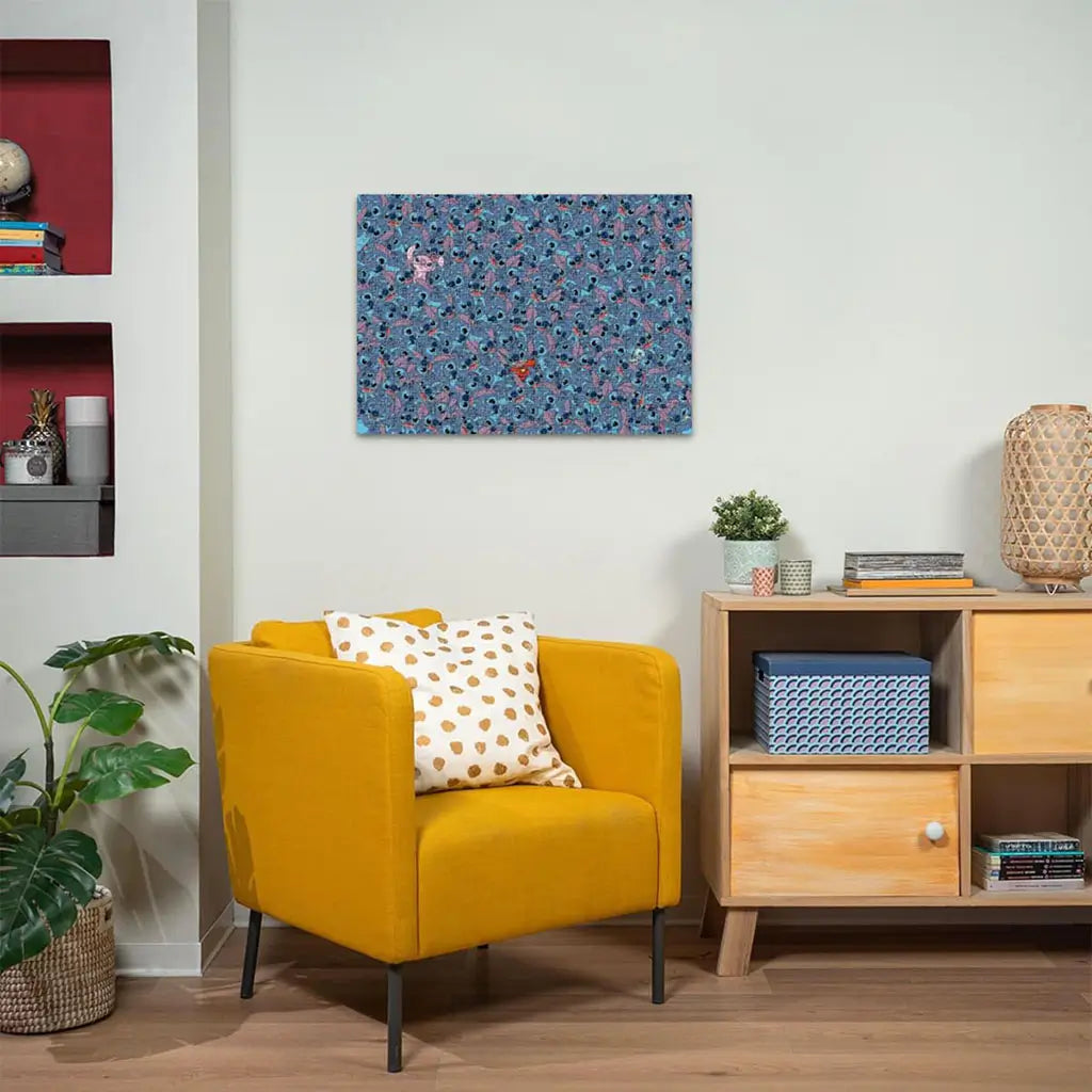 Completed Ravensburger Disney Stitch Challenge puzzle framed on a wall above a yellow chair shows a complex pattern of Stitch faces with hidden characters.