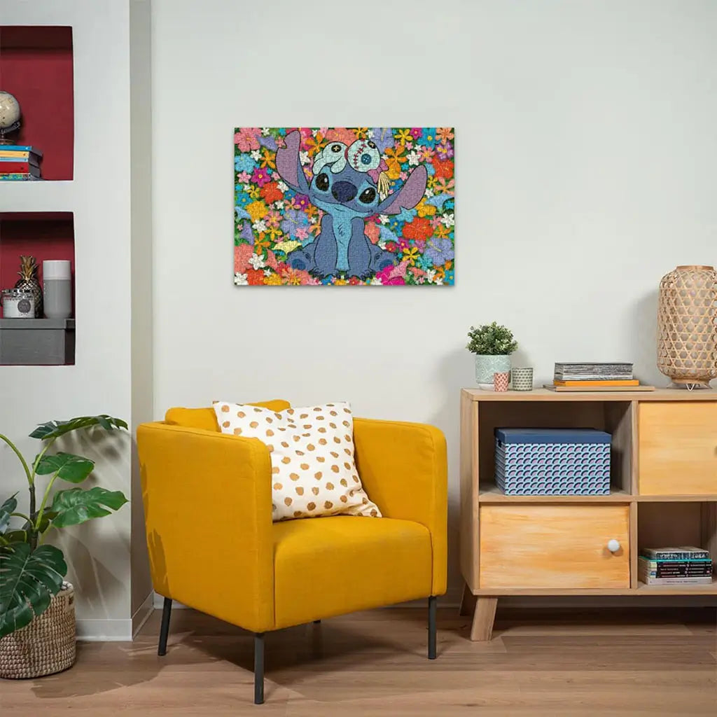 Finished Ravensburger Disney Stitch 1000-piece puzzle framed on a wall above a yellow armchair, showing Stitch with Scrump on his head against a vivid floral background.