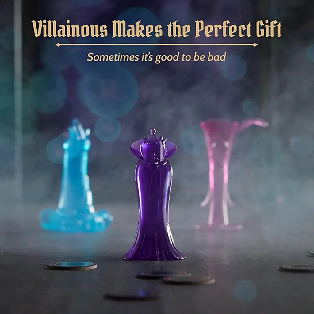 Disney Villainous Wicked to the Core figurine movers in translucent blue, purple, and pink shown on a smoky tabletop, highlighting the game’s gift appeal with the tagline above.