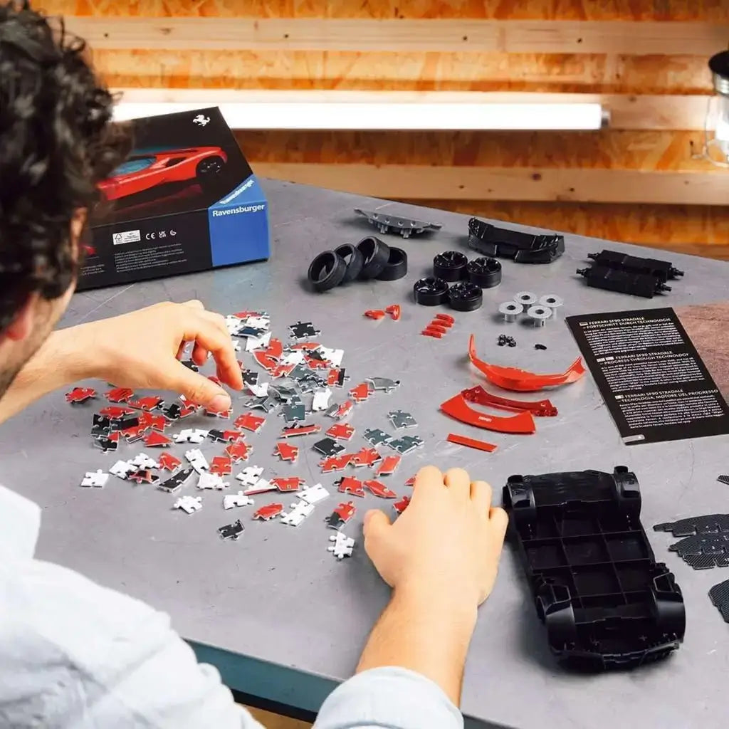 Box and completed Ravensburger Ferrari SF90 Stradale 3D Puzzle side by side, highlighting realistic model look.