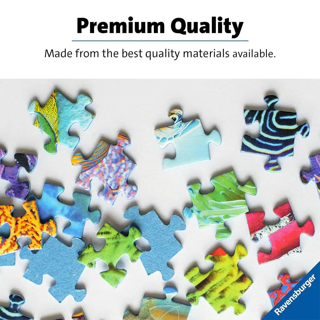 Bright Ravensburger puzzle pieces with glossy patterns in blue, green, red, and yellow scattered on a white background, highlighting premium quality materials.