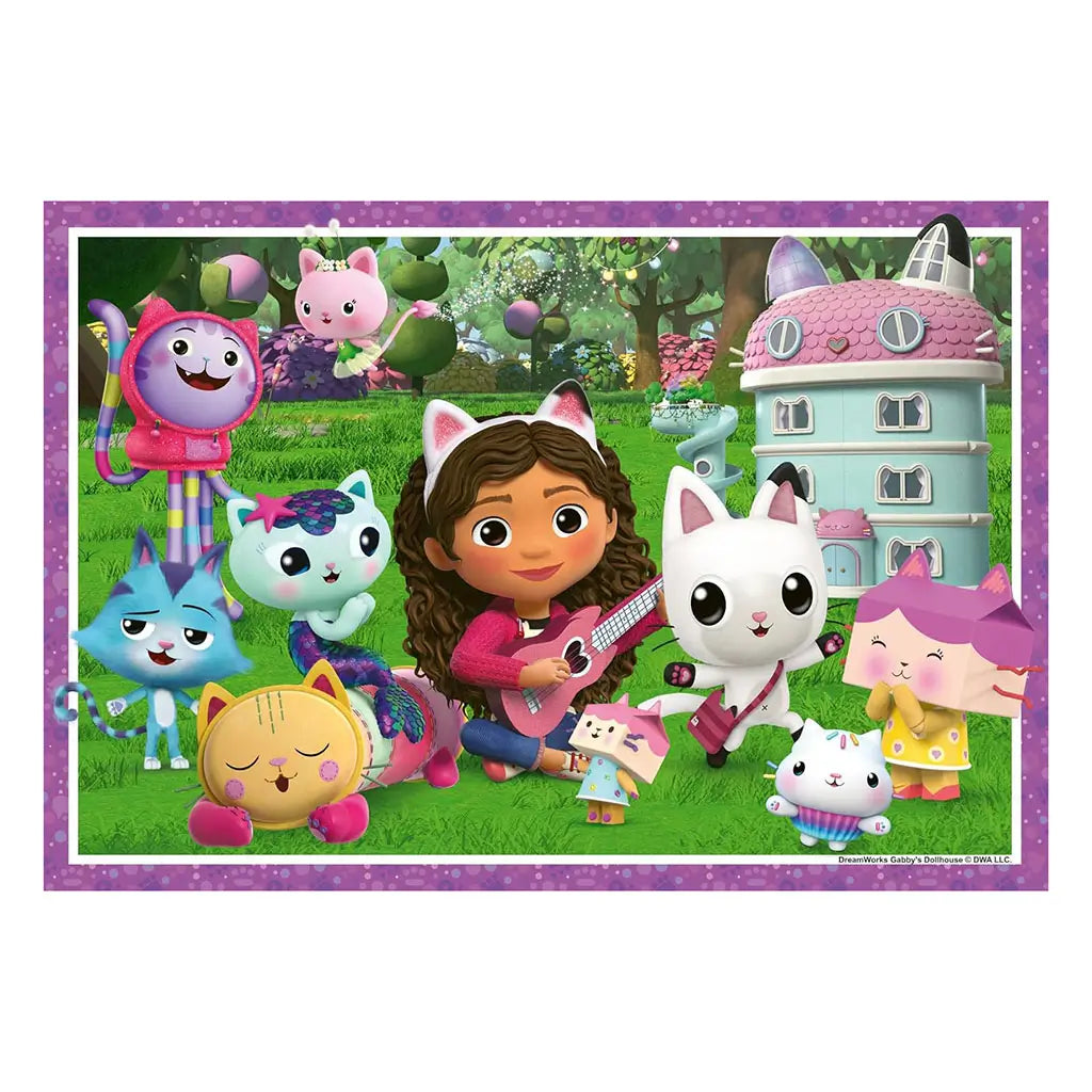 Cartoon Gabby from Gabby’s Dollhouse plays guitar on grass with cat companions of different colors near a teal dollhouse, surrounded by trees and flowers.