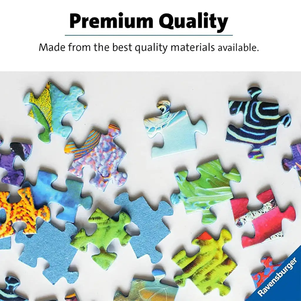 Colorful Ravensburger puzzle pieces with smooth edges and vivid printed patterns spread across a white surface, illustrating premium quality and safe materials.