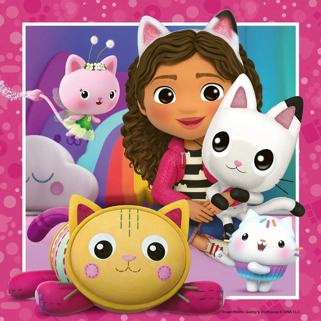 Gabby’s Dollhouse characters including Gabby with cat ears and four playful cats appear against a rainbow backdrop, showing cheerful friendship and fantasy play.