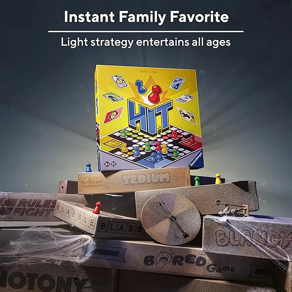 Ravensburger HIT board game box displayed on stacked dusty boxes with cobwebs, emphasizing light strategy family fun and colorful pawns around the package.
