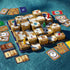 Ravensburger 3D Labyrinth complete game set with golden maze towers, colorful player pawns, treasure cards, and rune cards, offering a strategic adventure for players ages 7 and up.
