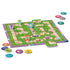 Close-up of the Gabby’s Dollhouse Labyrinth Junior board in play with character pawns, colorful tiles, and round tokens spread around the maze path.