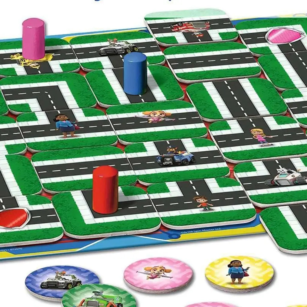 Paw Patrol Junior Labyrinth board game features green maze paths with shifting tiles, roadways, and colored player pegs, designed for kids to find characters along the puzzle route.
