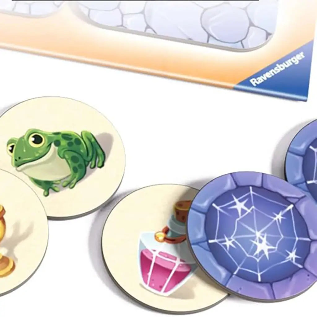 Ravensburger Labyrinth Junior board game tokens with colorful round pieces showing a green frog, purple spider web, and pink potion bottle against a stone maze design.