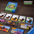 Close-up of Ravensburger Minecraft Explorers card game on wooden table, showing chest cards, resource cards, and adventure cards with colorful pixel graphics.