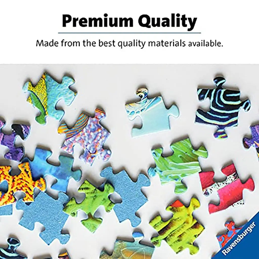 Scattered Ravensburger puzzle pieces with colorful, glossy print detail, highlighting premium cardboard construction and vibrant quality for precise and enjoyable assembly.