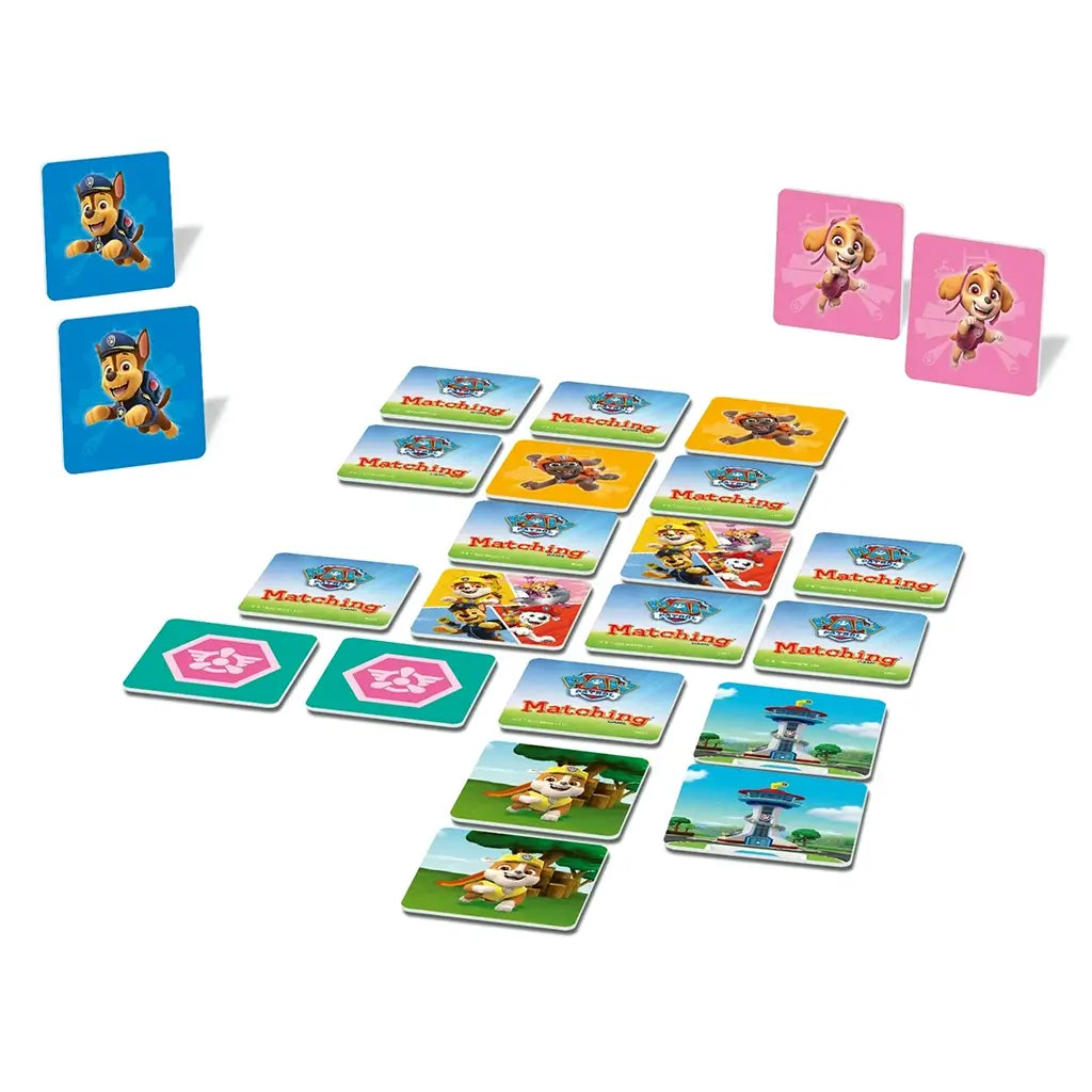 Paw Patrol matching game tiles arranged in rows, with colorful cards showing Chase, Skye, Rubble, and other pups on bright backgrounds alongside paw print icons.