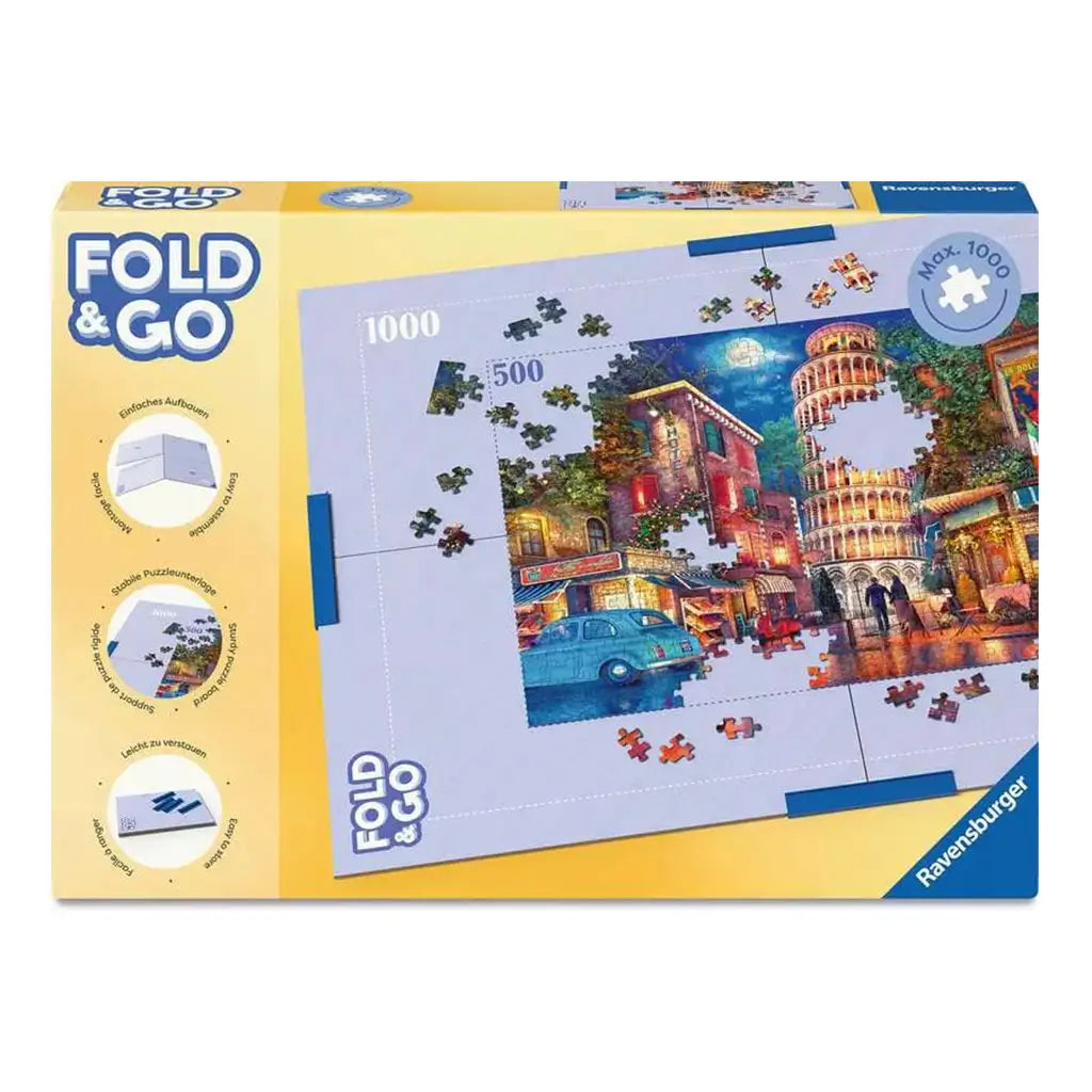Ravensburger Fold & Go puzzle storage case in yellow packaging shows a 1000-piece puzzle mat with colorful artwork of Pisa’s Leaning Tower and city scene, designed for portable assembly.
