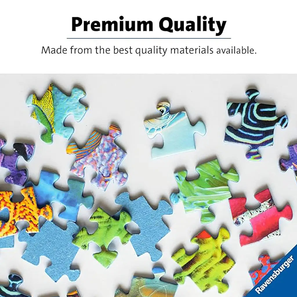 Close-up of scattered Ravensburger puzzle pieces with vibrant printed details, highlighting premium quality cardboard for durability and precise interlocking fit.