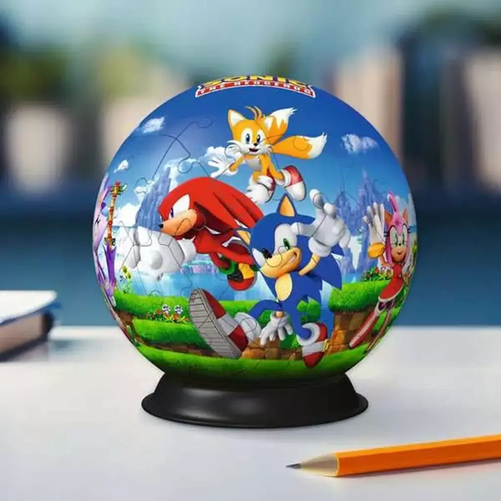 Fully assembled Sonic the Hedgehog 3D puzzle ball displayed on a desk, showing Sonic, Tails, Knuckles, and Amy in a vibrant, action-packed scene.