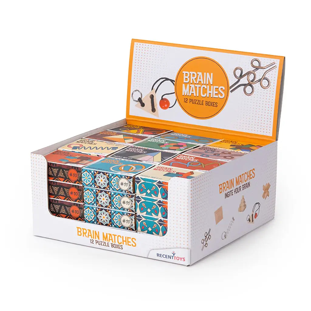 Brain Matches puzzle collection from Recent Toys, showing 12 matchbox-style packages with wooden, rope, and metal brain teaser challenges laid out in front.