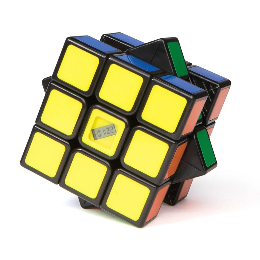 Rubik’s Timer Cube touch-sensitive puzzle shows a black 3x3 cube with yellow face and embedded digital screen, partially twisted to demonstrate responsive timing function.