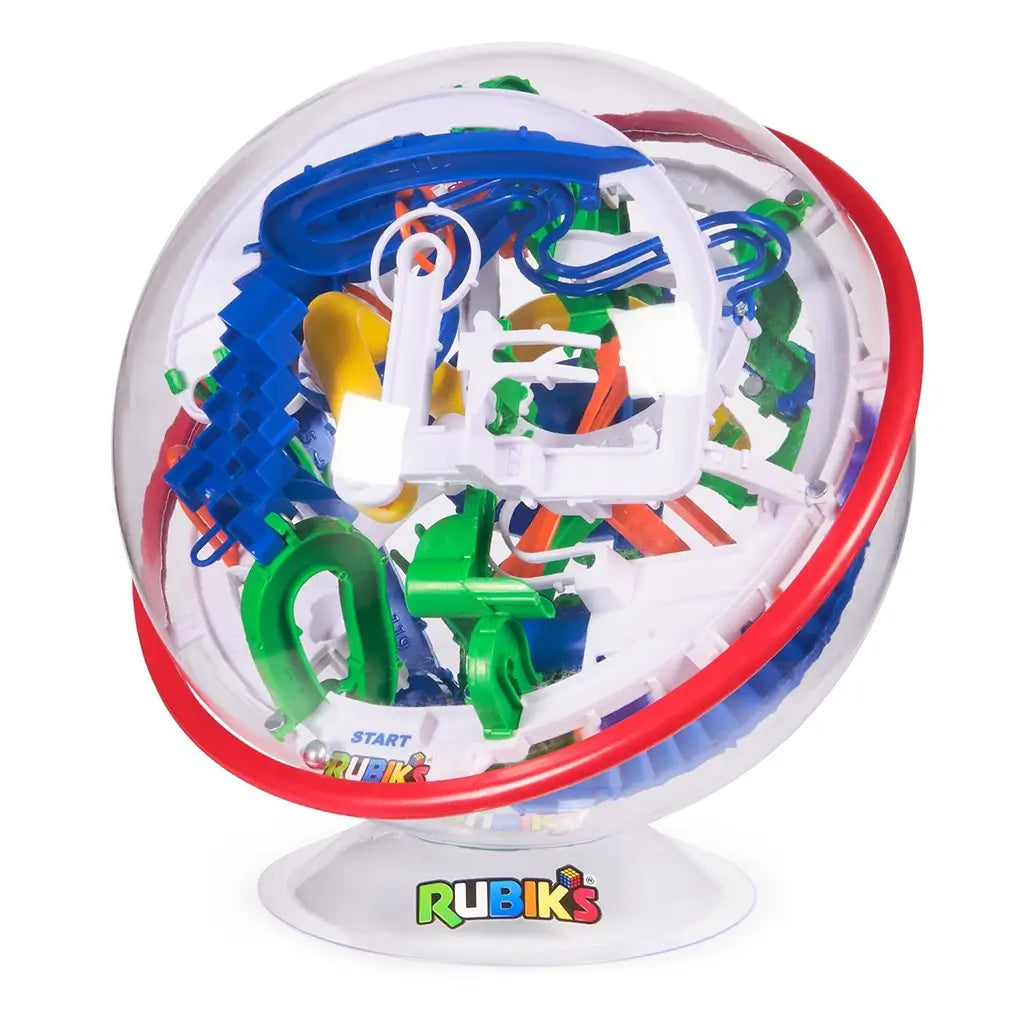 Rubik’s Tracks gravity maze sphere shows a transparent round plastic casing with red band and dense blue, green, white, and yellow track elements forming a handheld 3D balance puzzle.