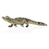 Schleich baby alligator toy with olive green and tan molded plastic scales, right side crawling profile, elongated body and tail, realistic limb placement, created for imaginative reptile play on a white studio background.