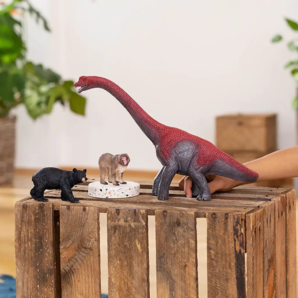 Schleich Dinosaurs Brachiosaurus Figure shown with a baboon and black bear.