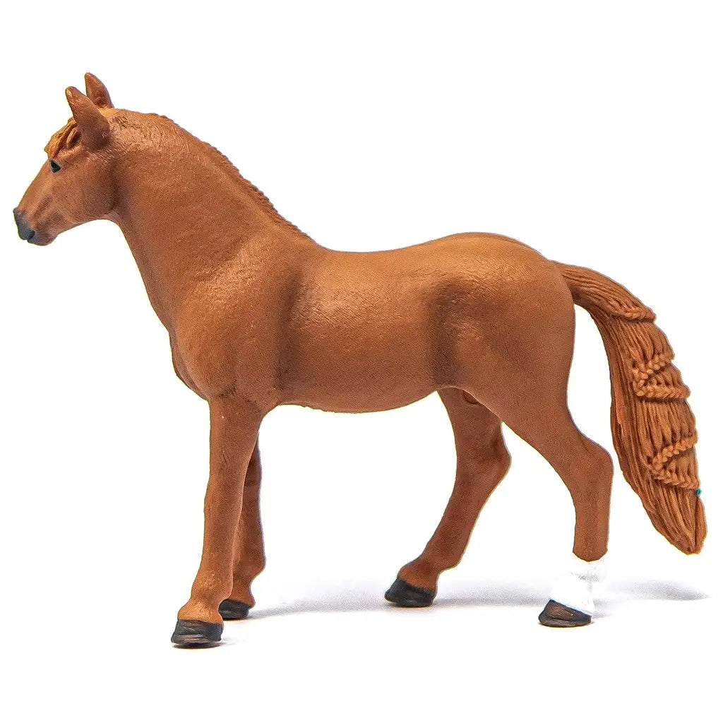 Schleich Horse Club German Riding Pony Mare figurine in warm chestnut brown plastic with fine hair texture, standing side profile with sculpted mane and tail, posed as a realistic toy horse model on a clean white background.