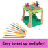 Sink N’ Sand board game partially assembled with explorer figures on sand platform, colorful sticks, and die laid out beside it, captioned “Easy to set up and play.”