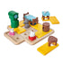 Smart Games Hide & Goat Seek puzzle set with colorful plastic pieces including goats, wolf, bed, table, barrel, and clock on a yellow-tiled board for preschool brain training.