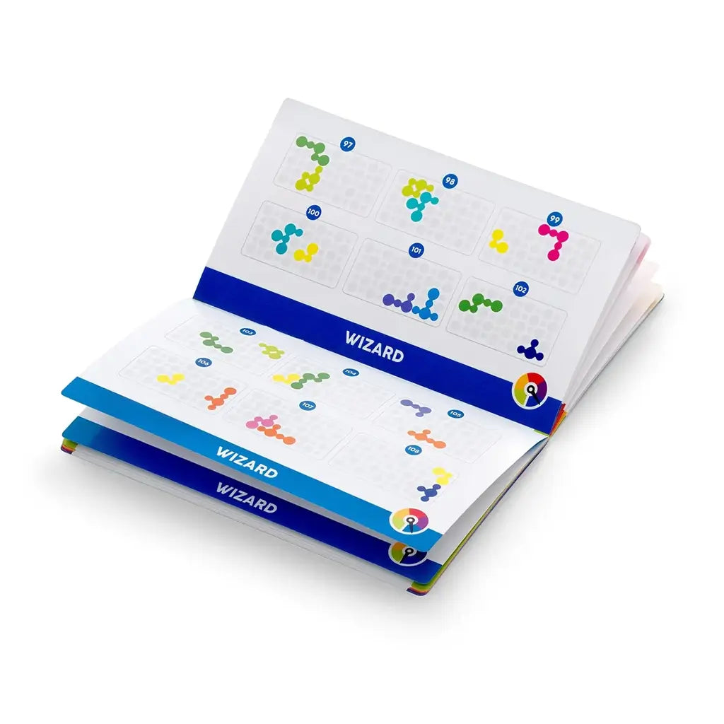 Puzzle booklet with white glossy pages, blue dividers labeled "Wizard," and colorful bubble piece diagrams arranged in numbered grids for Smart Games IQ Bubbles challenges.