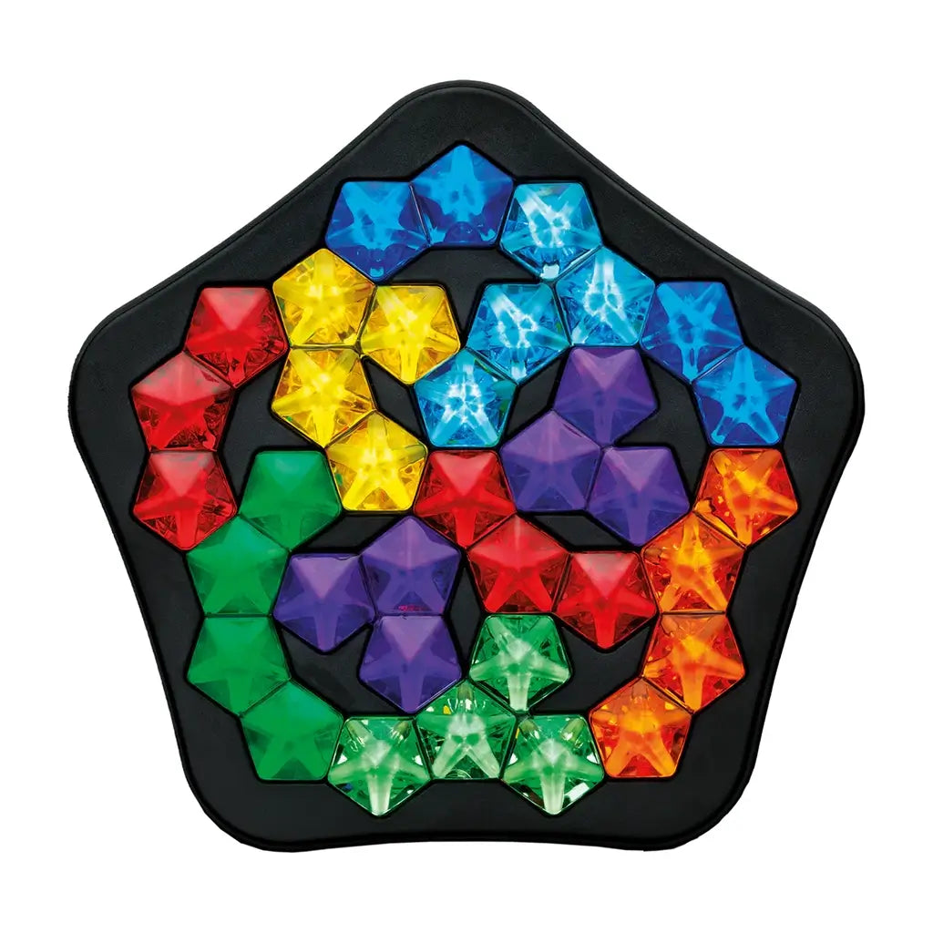 Puzzle game board with colorful plastic gem-shaped pieces in red, blue, green, yellow, orange, and purple arranged in a pentagon-shaped black tray.