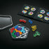 Open SmartGames IQ Pentagon set showing the black tray, bright gem-like puzzle pieces in various colors, a clear lid, and a challenge booklet with diagrams.