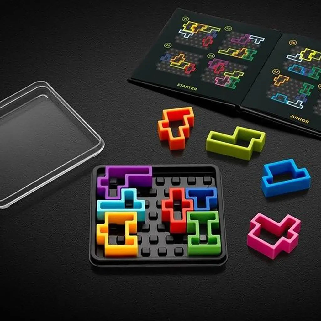 Open SmartGames IQ Square set with black tray, colorful Tetris-like puzzle pieces in bright neon shades, clear lid, and challenge booklet showing starter grids.