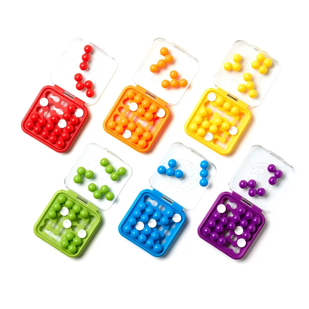 Assortment of SmartGames IQ Mini puzzles in red, orange, yellow, green, blue, and purple cases, each filled with glossy round bead-shaped logic pieces.