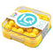 Close-up of yellow SmartGames IQ Mini puzzle in a clear square plastic case with logo label, featuring glossy spherical beads for engaging solo play.