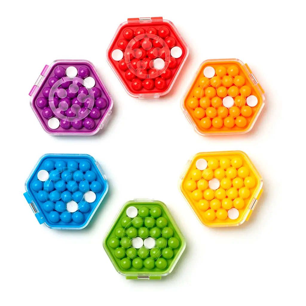 Set of IQ Mini Hexpert puzzles in hexagonal cases with clear lids, displayed in red, yellow, green, blue, and purple, each filled with matching colored sphere pieces.