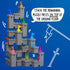 Smart Games Tower Stacks puzzle shows gray castle towers with colorful flags stacked high, demonstrating how pieces interlock to build vertically from the ground floor.